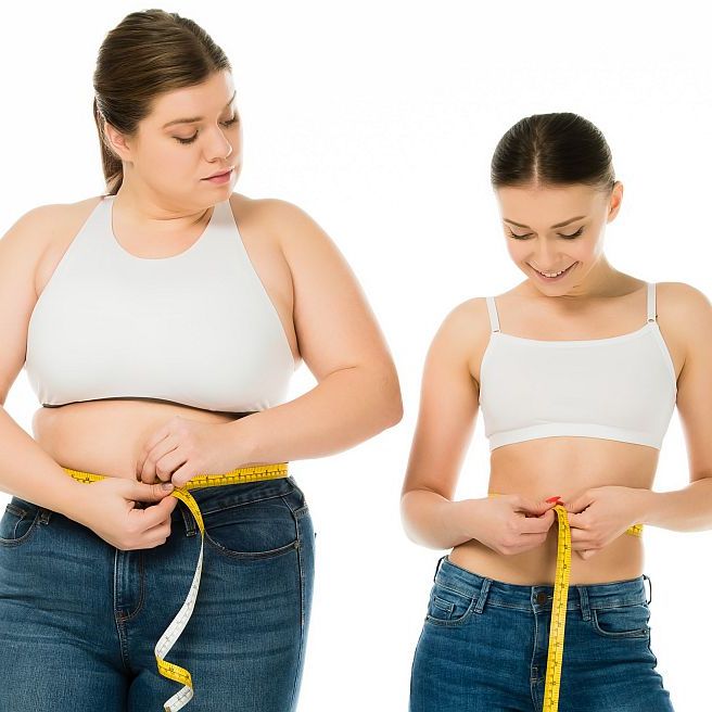 Two Women Comparing Waist Size